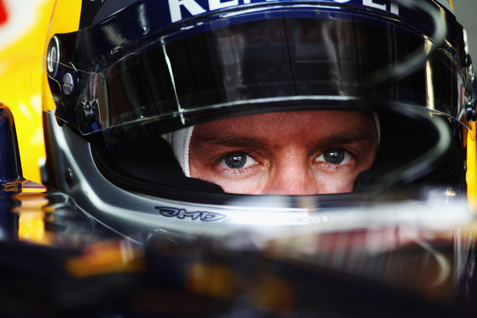 Vettel breaks record with pole in Brazil