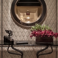 The entryway features a leather wall and leather tile